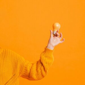 front-view-hand-with-yellow-bulbs_23-2148450453